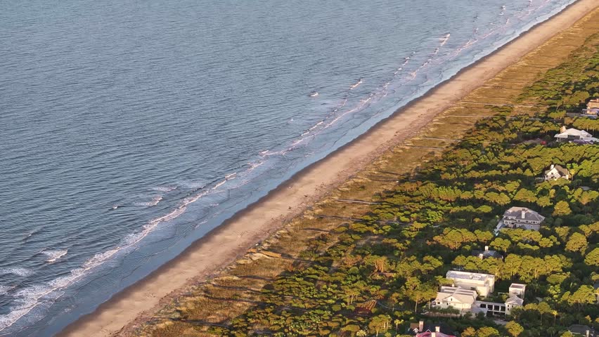 Aerial view of beachfront mansion homes along Kiawah Island landscapes near Charleston, South Carolina showcasing the lowcountry coast and natural beauty - 4K Drone