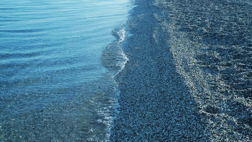 Vacation on the seashore. Transparent waves.