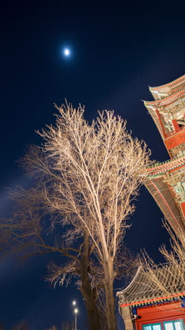 Moonlit night sky above the Drum Tower in Beijing, China