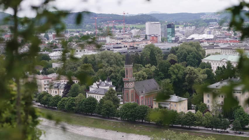 Historic Christuskirche Protestant church surrounded by green trees in Salzburg city, Austria.