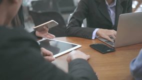 This tightly framed shot zeroes in on the hands and digital tools of two business professionals engaged in their work. One person's hands are actively typing on a silver laptop, indicating focused task execution or data entry. Simultaneously, another individual holds a smartphone, suggesting a parallel activity like checking messages, making notes, or accessing information on the go. The subtle focus on the devices rather than faces emphasizes the integral role of technology in today's corporate world, illustrating concepts of digital productivity, mobile work, and the seamless integration of various tools in daily business operations and communication. - Powered by Shutterstock - Get 15% off with code: PIKWIZARD15