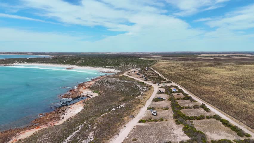 Daly Head coastline with ocean road, cliffs, and rugged South Australian shoreline, camping plots overlooking clear blue water