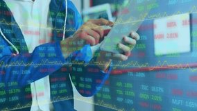 Animation of financial data processing over businessman using tablet in office. Global business, finance, computing and data processing concept digitally generated video. - Powered by Shutterstock - Get 15% off with code: PIKWIZARD15