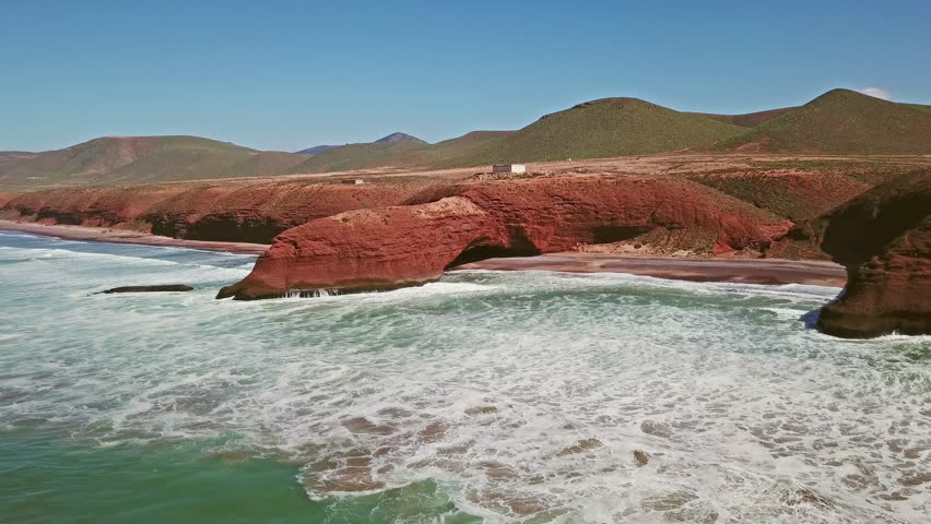 Aerial view on Legzira beach with arched rocks on the Atlantic coast in Morocco, 4k