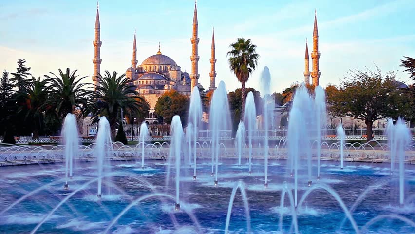 Majestic view of the Sultan Ahmed Mosque (Blue Mosque) in Istanbul, Turkey. Iconic Ottoman architecture with six minarets and grand domes under a soft sunset sky, 