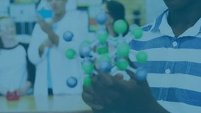 Animation of moving shapes over african american schoolboy in lab. school and education concept digitally generated video. - Powered by Shutterstock - Get 15% off with code: PIKWIZARD15