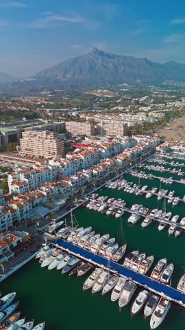 Aerial view of the luxurious Marbella resort town, Costa del Sol, Andalusia, Spain. Popular luxury and exclusive area of Marbella, Golden Mile beach. Top view of the expensive villas and hotels