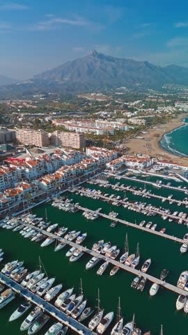 Aerial view of the luxurious Marbella resort town, Costa del Sol, Andalusia, Spain. Popular luxury and exclusive area of Marbella, Golden Mile beach. Top view of the expensive villas and hotels