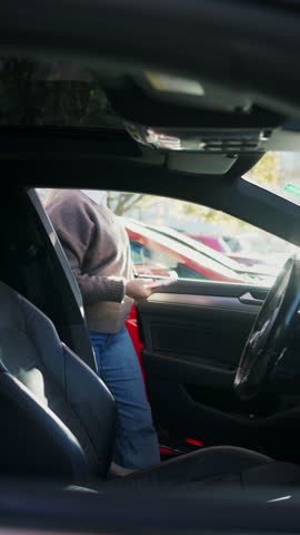Woman driving car to work. City commuter.
