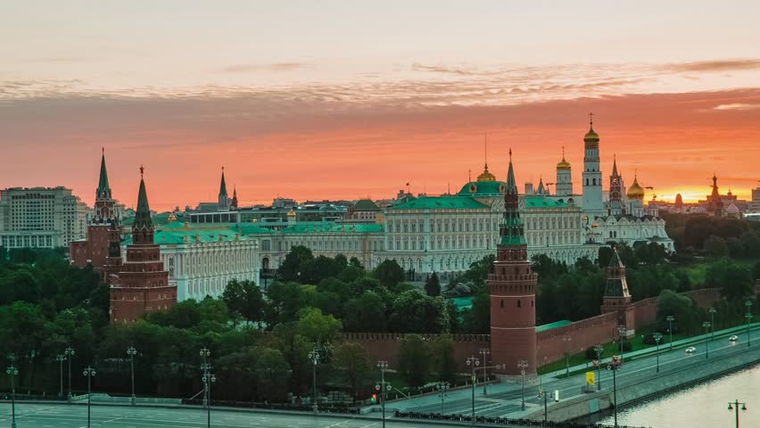 Aerial view of Moscow skyline at vibrant sunset, Russia. Panoramic cityscape featuring dramatic sky, glowing clouds, and Moscow River at dusk. Stunning high-angle drone photography.