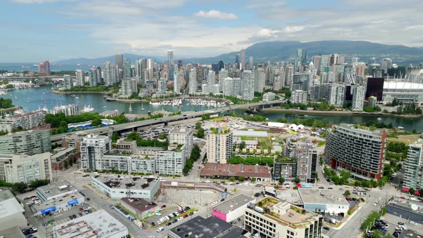 Flyover Cambie Bridge Spanning False Creek In Vancouver, British Columbia, Canada. Aerial Drone Shot