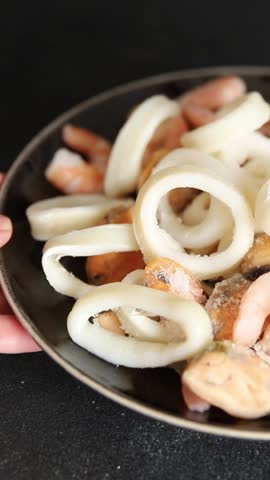 Raw seafood mix shrimp, scallops, mussels, prawns tasty snack fresh delicious gourmet food background on the table rustic food top view copy space pescetarian diet