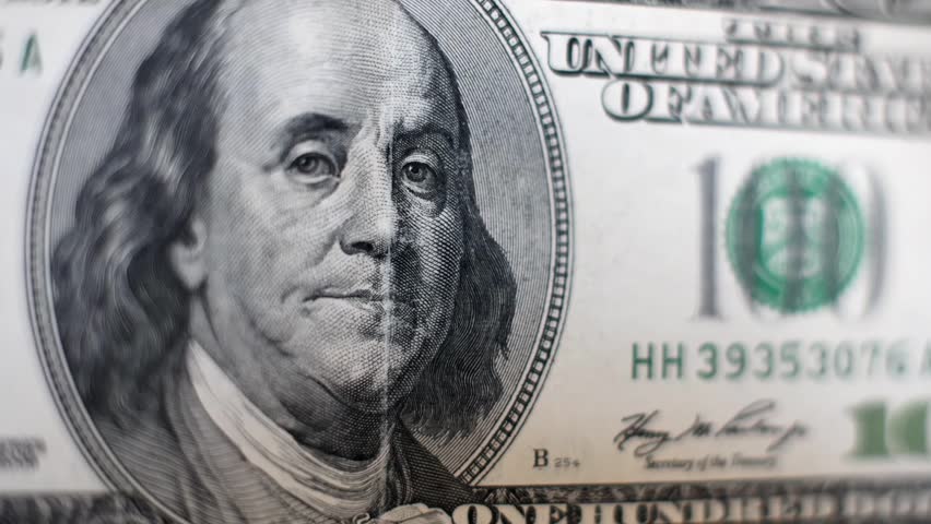 Macro Slow Motion Pan Over Benjamin Franklin Portrait on 100 Dollar Bill - US Currency Financial Background