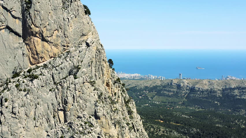 Aerial view of the skyscrapers of Benidorm Beach from the mountain range od Puig Campana in the interior of the Mediterranean city of Benidorm, Spain.