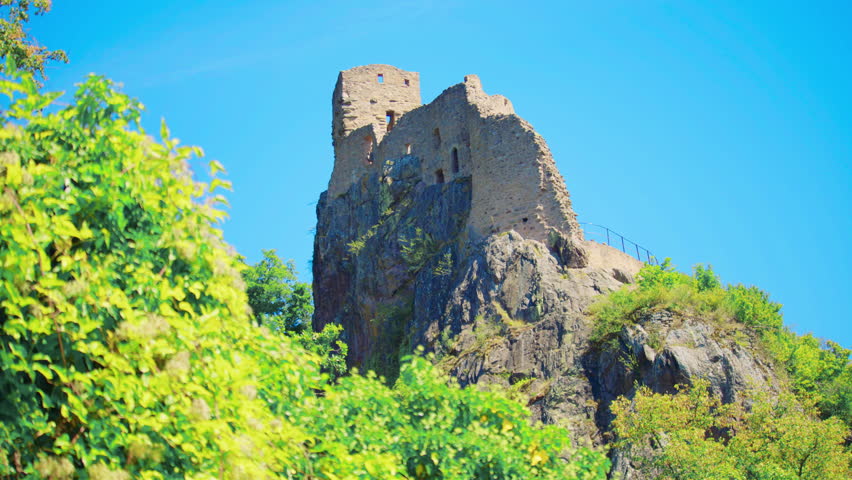 Close view of ancient castle wall showing rough stone texture weathering and medieval masonry