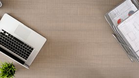 Top view of a financial meeting with professionals reviewing documents, charts, and laptops, highlighting corporate strategy, teamwork, and business planning. - Powered by Shutterstock - Get 15% off with code: PIKWIZARD15
