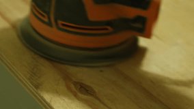Sanding wood surface with power sander in a workshop during day - Powered by Shutterstock - Get 15% off with code: PIKWIZARD15