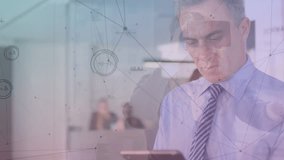 Network of connections and data processing against caucasian senior businesman using digital tablet. global networking and business technology concept - Powered by Shutterstock - Get 15% off with code: PIKWIZARD15