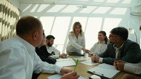 Businesswoman leading corporate meeting and brainstorming session - Powered by Shutterstock - Get 15% off with code: PIKWIZARD15