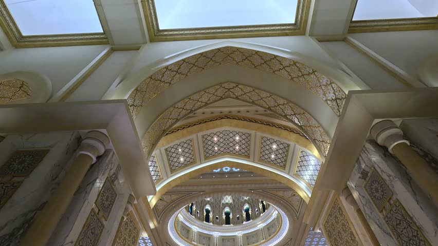 Views of the Oriental Palace. Architectural elements of buildings, arches and columns, windows and doors. On the streets of the Abu Dhabi, in public spaces.