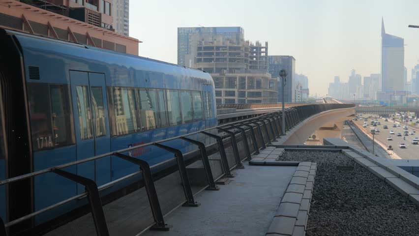 City views, Metro and rails. Skyscrapers and roads, streets and buildings. On the streets of Dubai, in a public place.