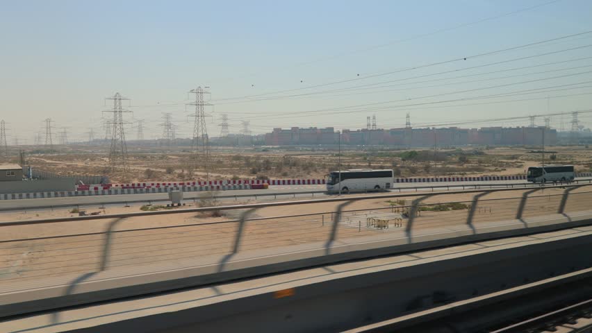 City views, Metro and rails. Skyscrapers and roads, streets and buildings. On the streets of Dubai, in a public place.
