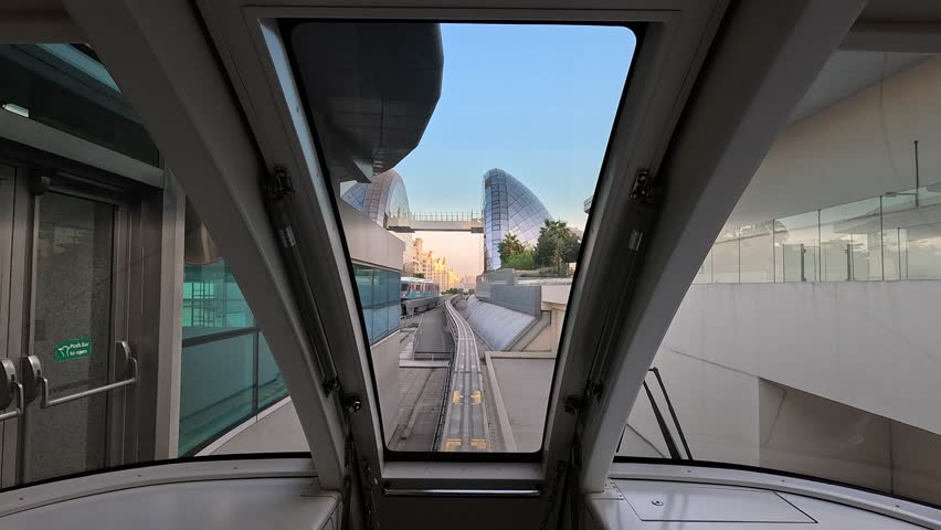 City views, Metro and rails. Skyscrapers and roads, streets and buildings. On the streets of Dubai, in a public place.