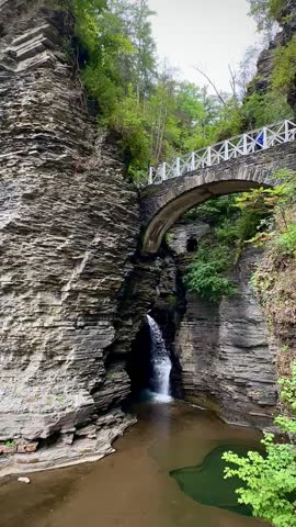 Waterfall Pouring into Lake Under a Bridge (Watkins Glen State Park, Watkins Glen, New York, USA)