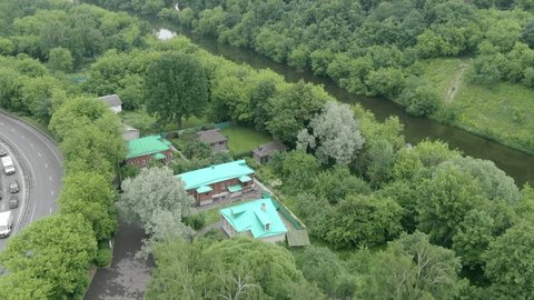 Circular Drone Flight over River Houses