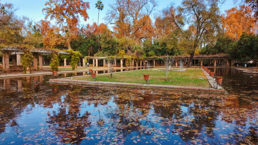 The Parque de Maria Luisa, Seville, Andalusia, Spain, expansive lush park with gardens, fountains and monuments
