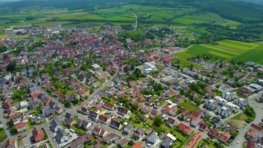 Aerial view of the city Bad Staffelstein in Germany, on a cloudy day in spring.