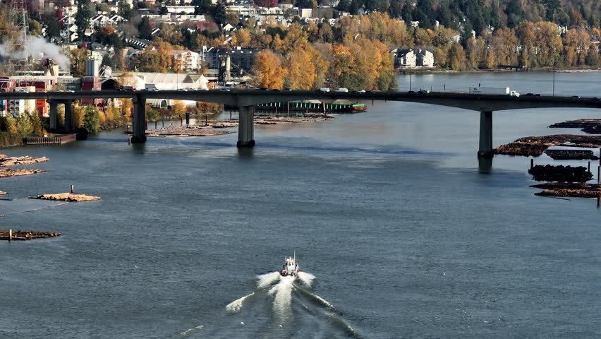 Spill Response Boat Crossing Under The Bridge Over Fraser River Near Delta And Tilbury Island In Canada. Aerial Shot