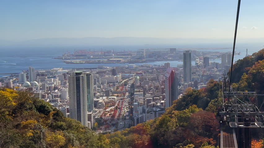 Kobe Japan autumn city skyline seen from descending cable car gondola