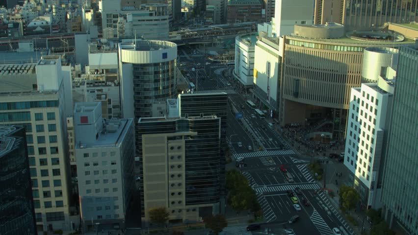 Light traffic on wide city street in downtown Kobe Japan at golden hour