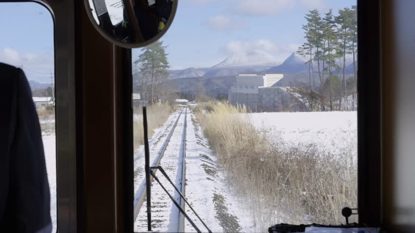 Train tracks running into distance at rural landscape in Japan