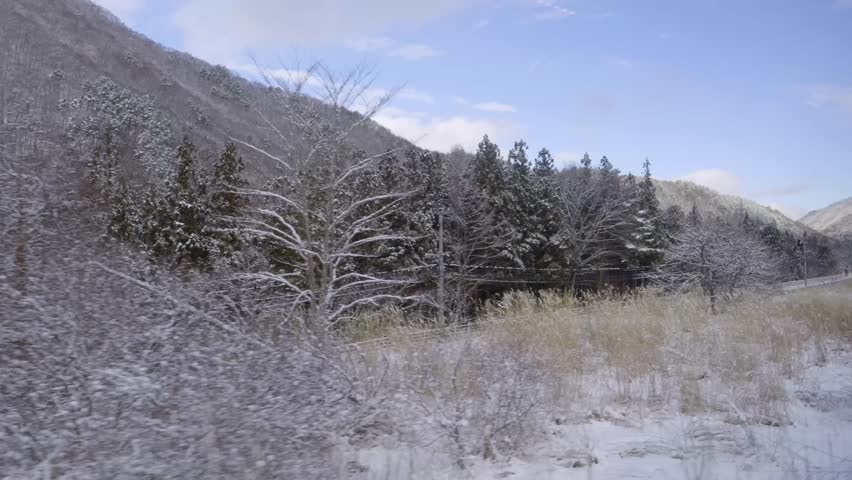 Japanese rural winter landscape with outside views from train