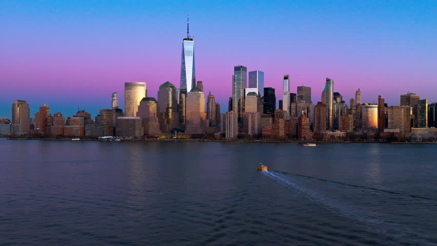 New York City cityscape, NYC aerial view. New York Manhattan panorama with towers at sunset. New York iconic aerial view. NYC Manhattan in dark blue sky at dusk. New York aerial cityscape.