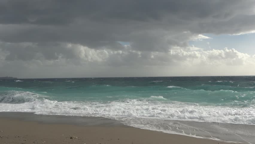 A strong, stormy wind breaks huge waves of the Mediterranean Sea on the beaches of the coast of Antalya, Turkey.