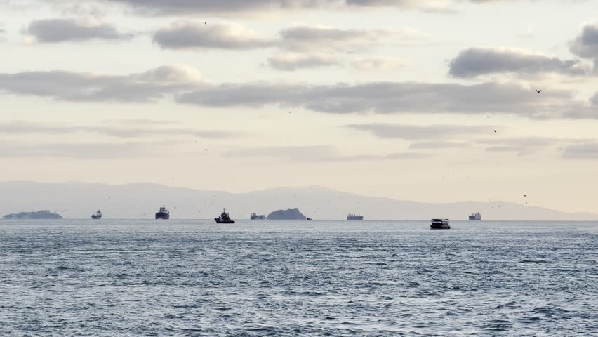 Boat on the beach, Calm Sea with Boats Under Cloudy Sky