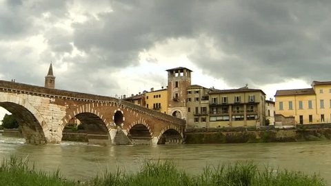 Timelapse with pan and zoom. Storm clouds over 'Ponte Pietra', in Verona, Italy.