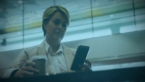 Animation of level up text and data processing over caucasian businesswoman using smartphone. Global video game, business, connections, computing and data processing concept digitally generated video. - Powered by Shutterstock - Get 15% off with code: PIKWIZARD15