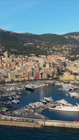 Aerial Vertical Cityscape Golden Hour Over Facades, Hillside Skyline And Coastal Bay Drone Sweeps Across Ornate Palace. Monaco