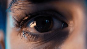 Extreme macro closeup of a human eye with futuristic digital interface reflections in the pupil. Concept of artificial intelligence, biometric scanning, augmented reality, data processing, cyber technology and human-machine interaction. High-detail cinematic footage, ideal for technology, innovation, security, AI and future tech visual concepts. - Powered by Shutterstock - Get 15% off with code: PIKWIZARD15