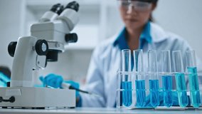 Researcher experimenting in lab.Advanced Scientific Lab for Medicine,Biotechnology,Microbiology Development.Medical Research Laboratory.scientist analyzes chemical samples using pipette in laboratory - Powered by Shutterstock - Get 15% off with code: PIKWIZARD15