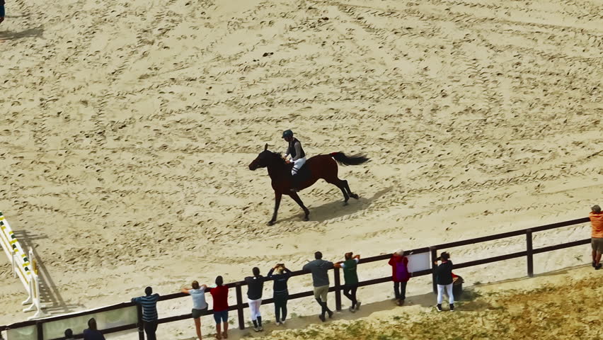 Aerial view of equestrian competition outdoors jumping hurdle