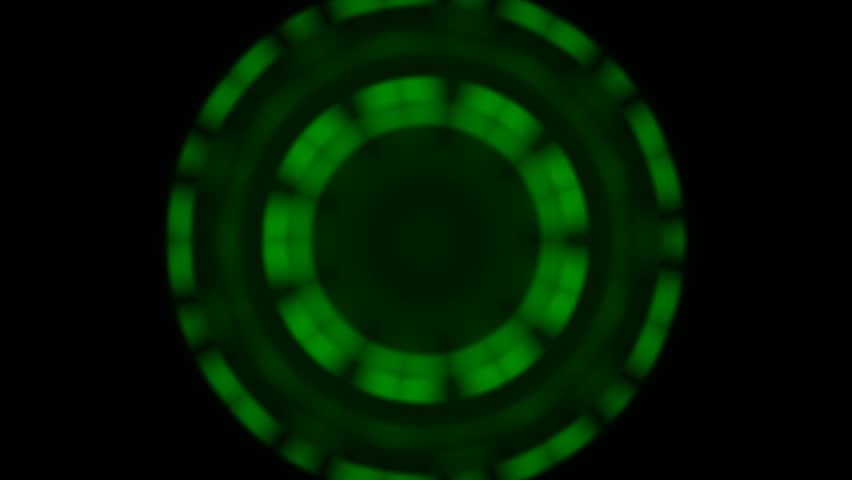 Abstract glowing green oval shape with vibrant symmetrical patterns on a deep black background, creating a hypnotic and futuristic digital art piece for technology concepts and motion graphics
