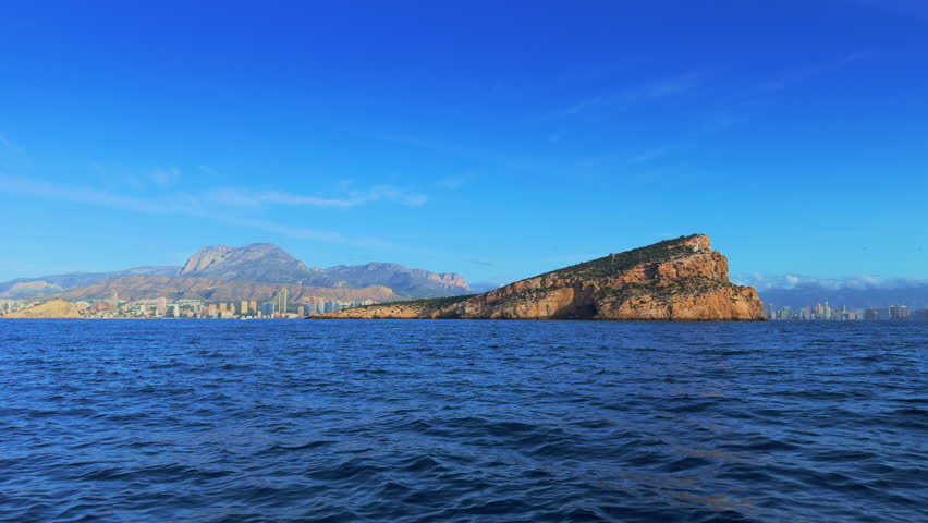 Benidorm Island and city skyline from boat Costa Blanca Spain
