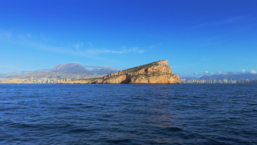 Benidorm Island and city skyline from boat Costa Blanca Spain
