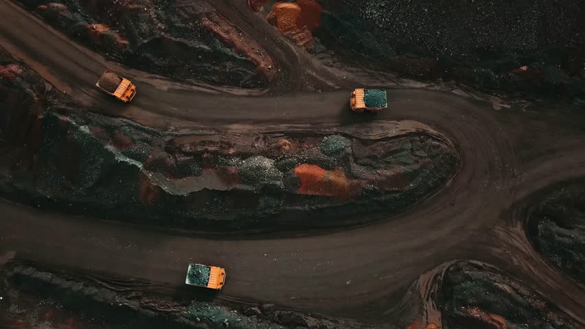 An aerial view of a quarry truck transporting iron ore.