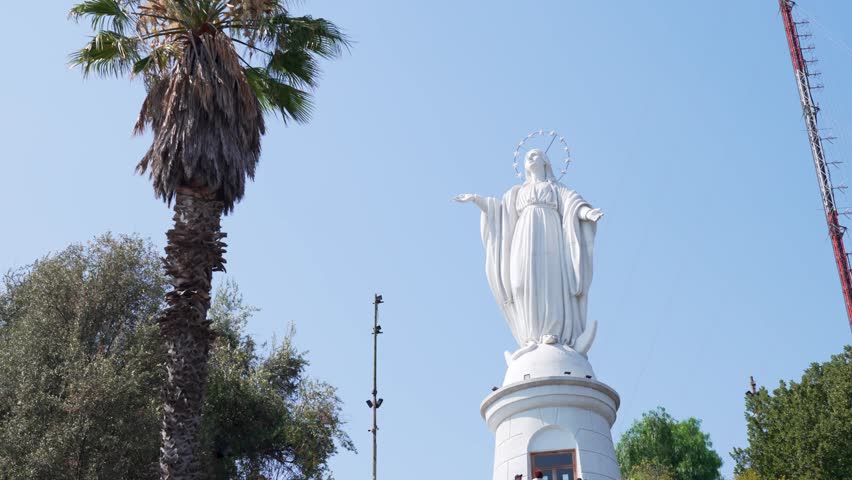 Majestic white statue of the virgin mary at the summit of san cristobal hill in santiago, chile